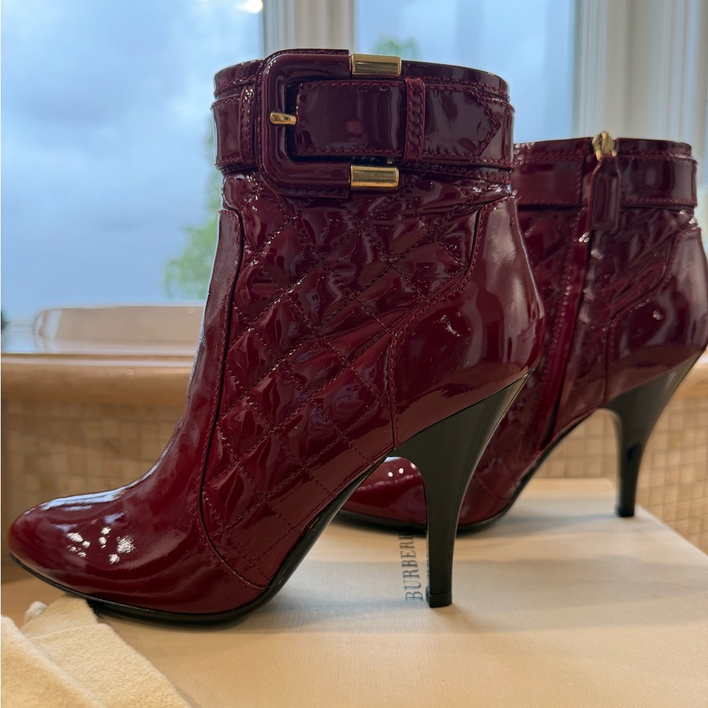 Burberry Berry Patent Leather 4 inch  heel boots with decorative buckle.